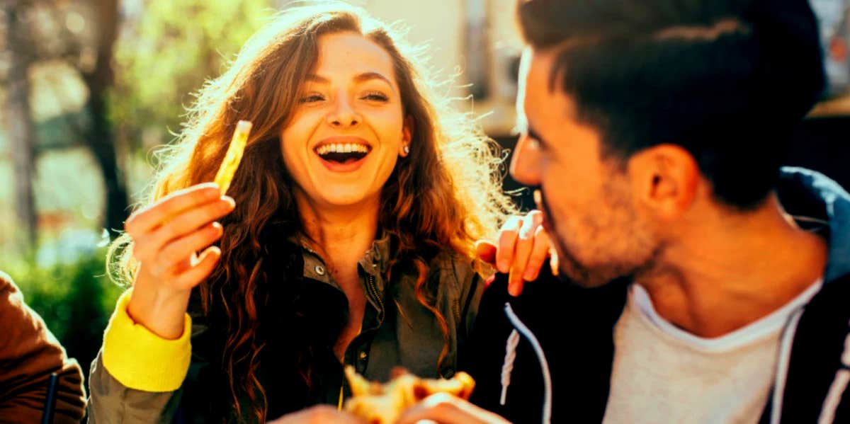 couple eating and laughing together