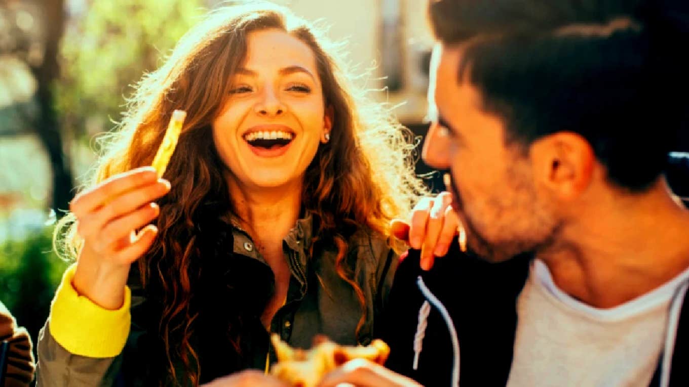 couple eating and laughing together