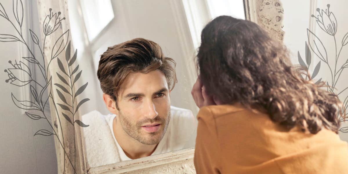 Woman looking into mirror