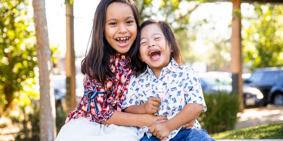 siblings laughing 