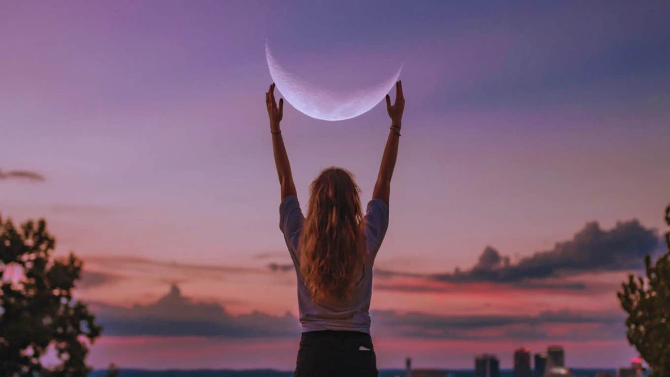woman holding the moon