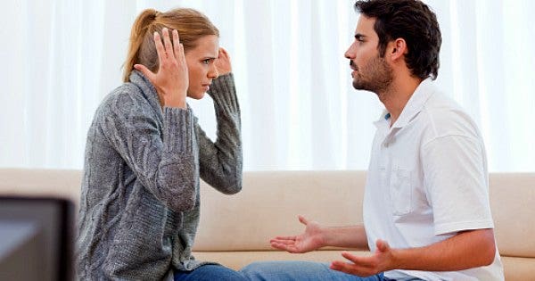 couple arguing on sofa