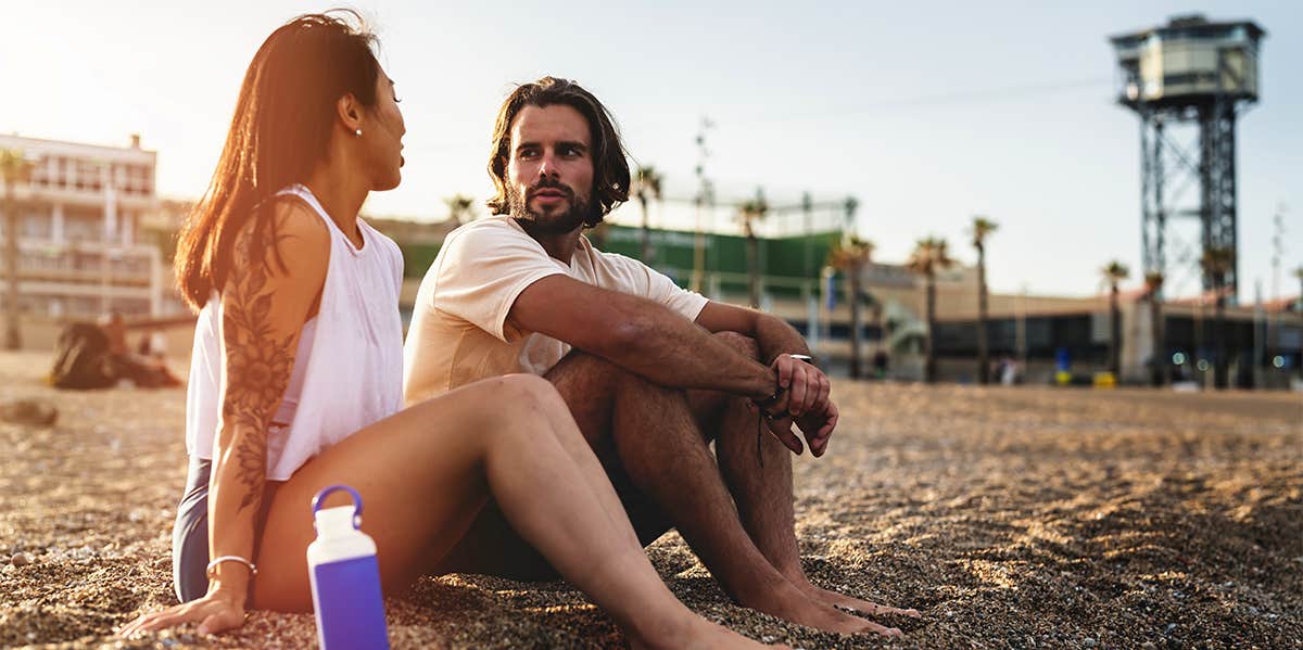 couple chatting on the beach