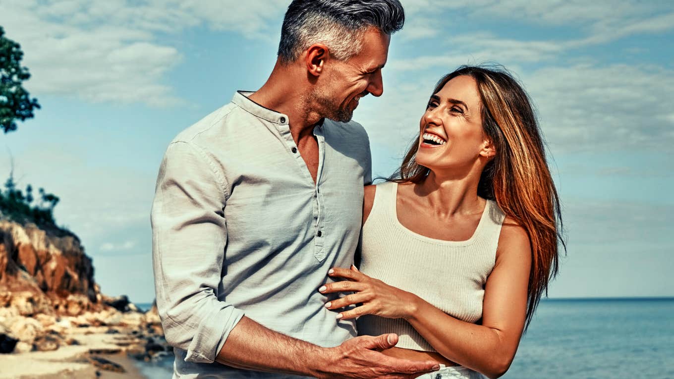 couple smiling on the beach