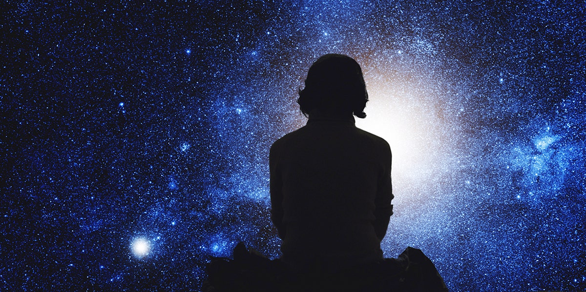 How Astrology Cured My Panic Attacks woman sitting watching stars
