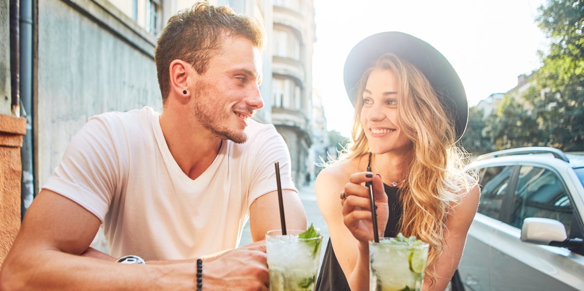 man and woman having drinks