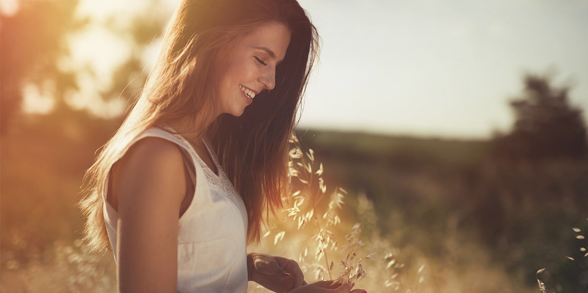 woman in side profile in sunset