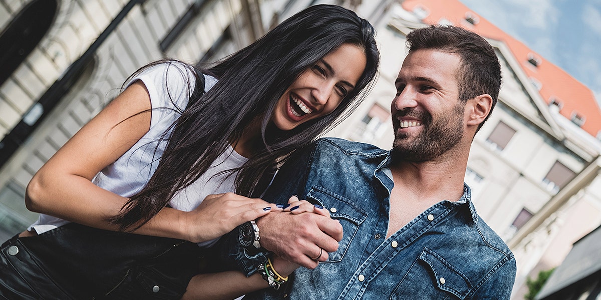 woman laughing with man