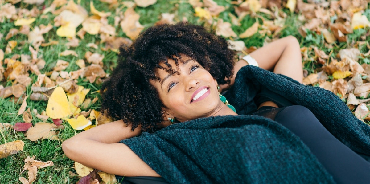 woman lying on leaves