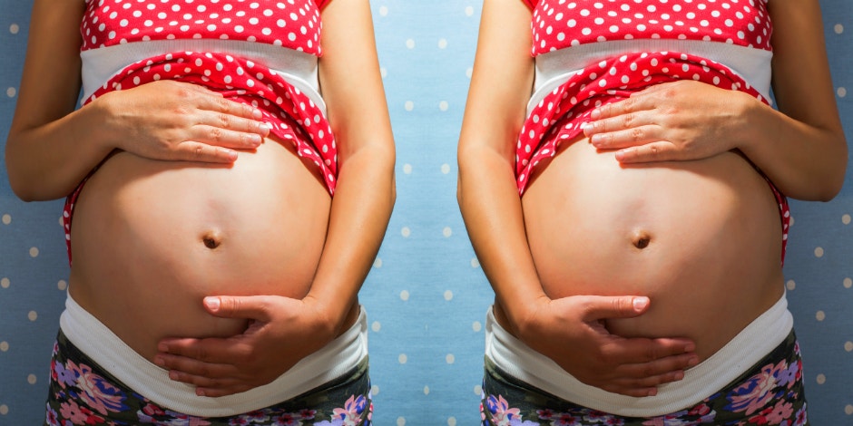 woman holding pregnant belly