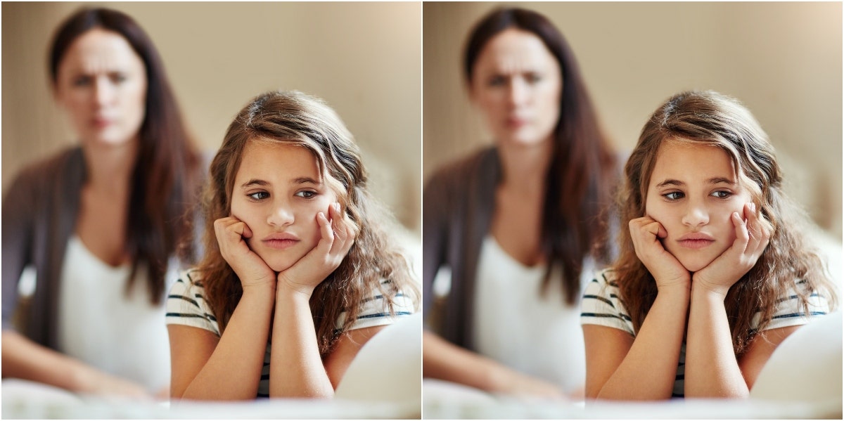 sad little girl with mom behind her