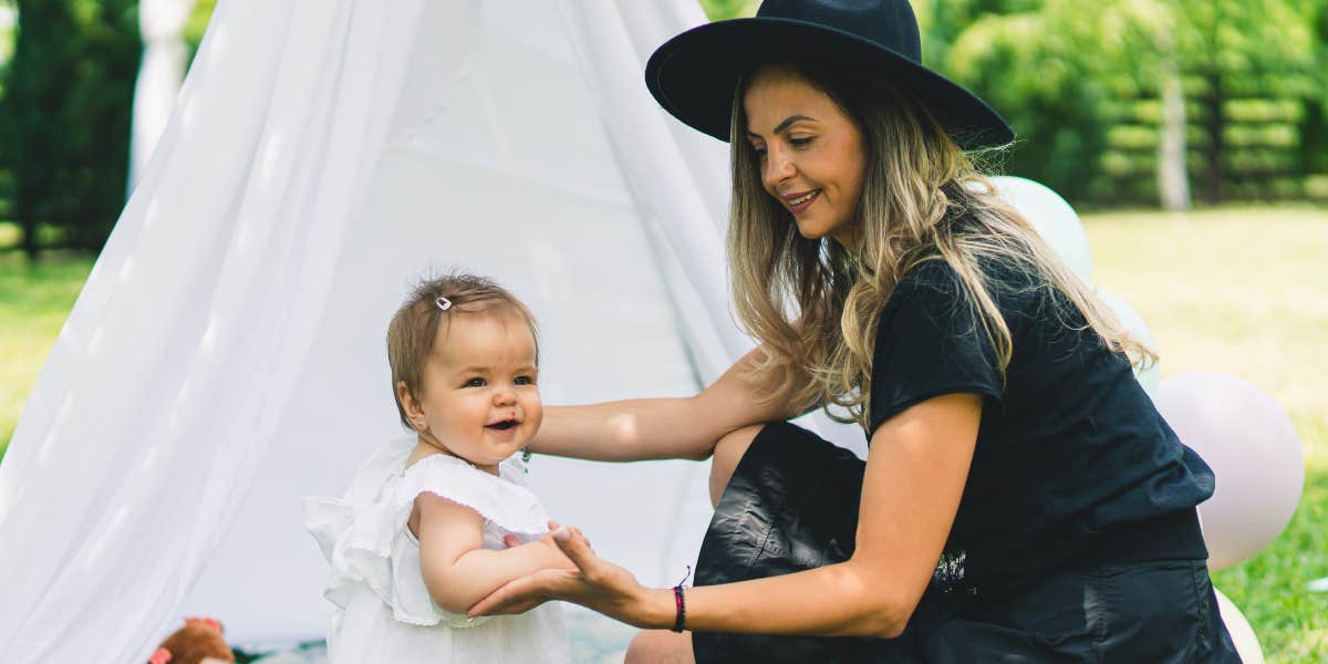 Baby and mom playing outside