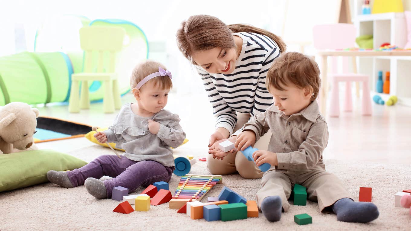 babysitter playing with two young kids