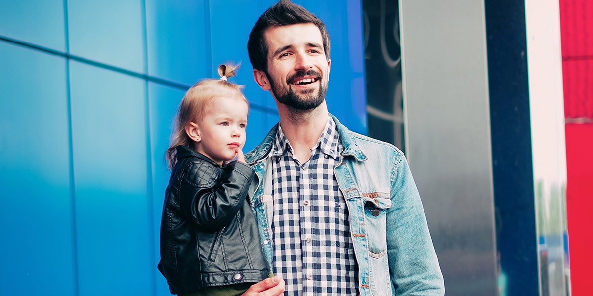 husband holding baby