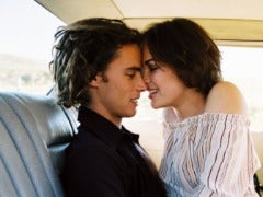 couple kissing backseat of car