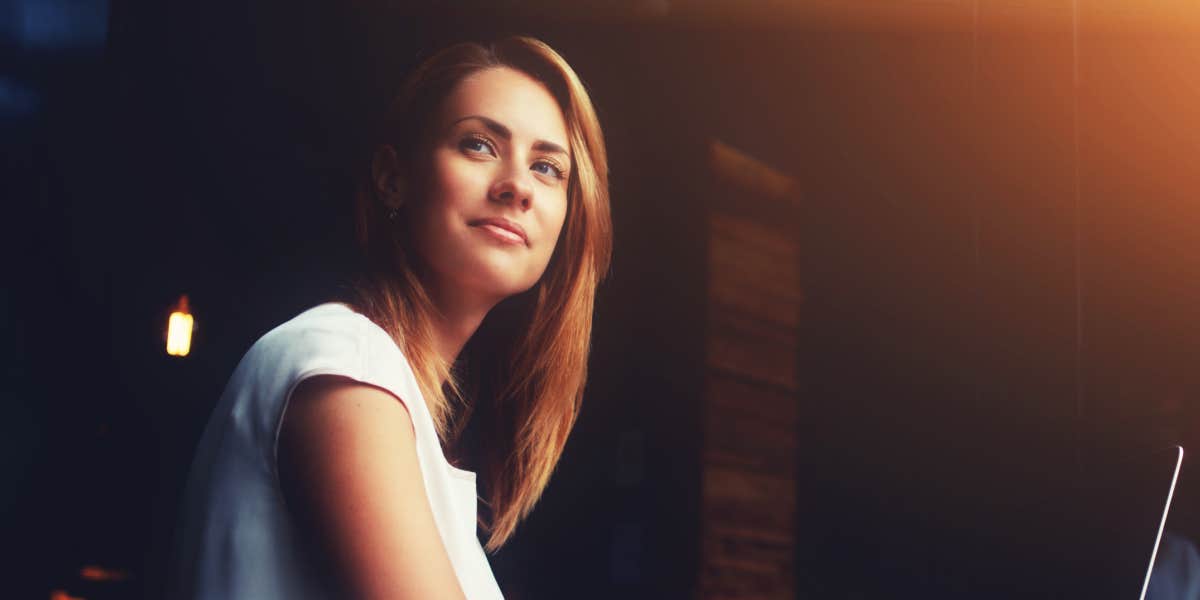 young white woman with medium brown hair looking just off camera