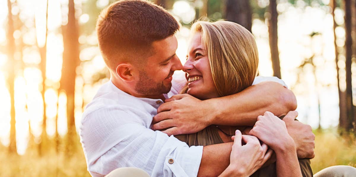 Two gorgeous people in love embrace