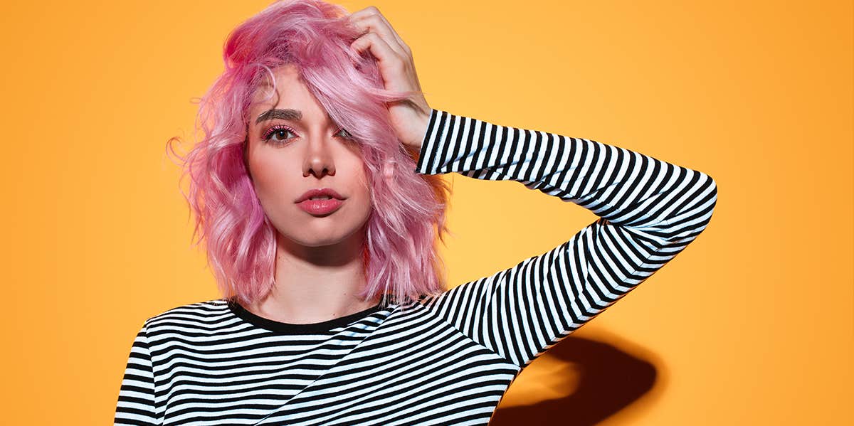 Beautiful Ways To Reclaim Your Life When You're Broken woman with hand in pink hair