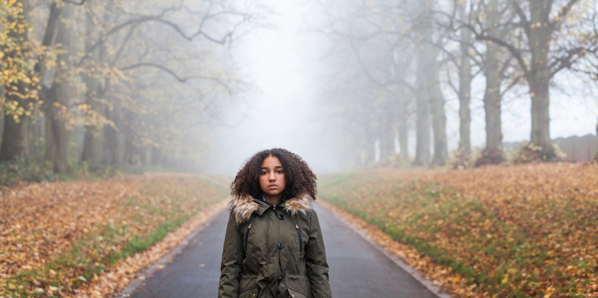 woman in the middle of an empty road