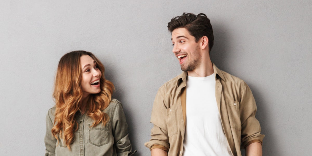 man and woman smiling at each other