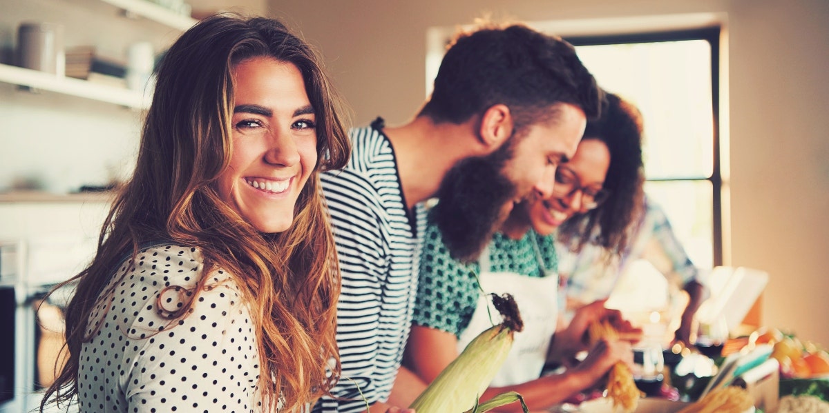 woman smiling at the camera with friends