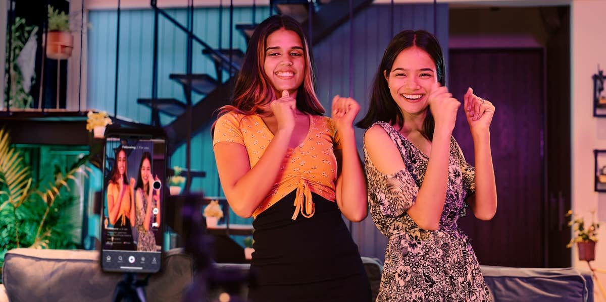 women filming their dance on phone