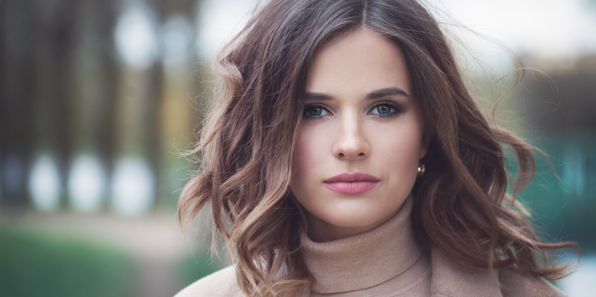 Benevolent sexism smiling woman in a turtleneck