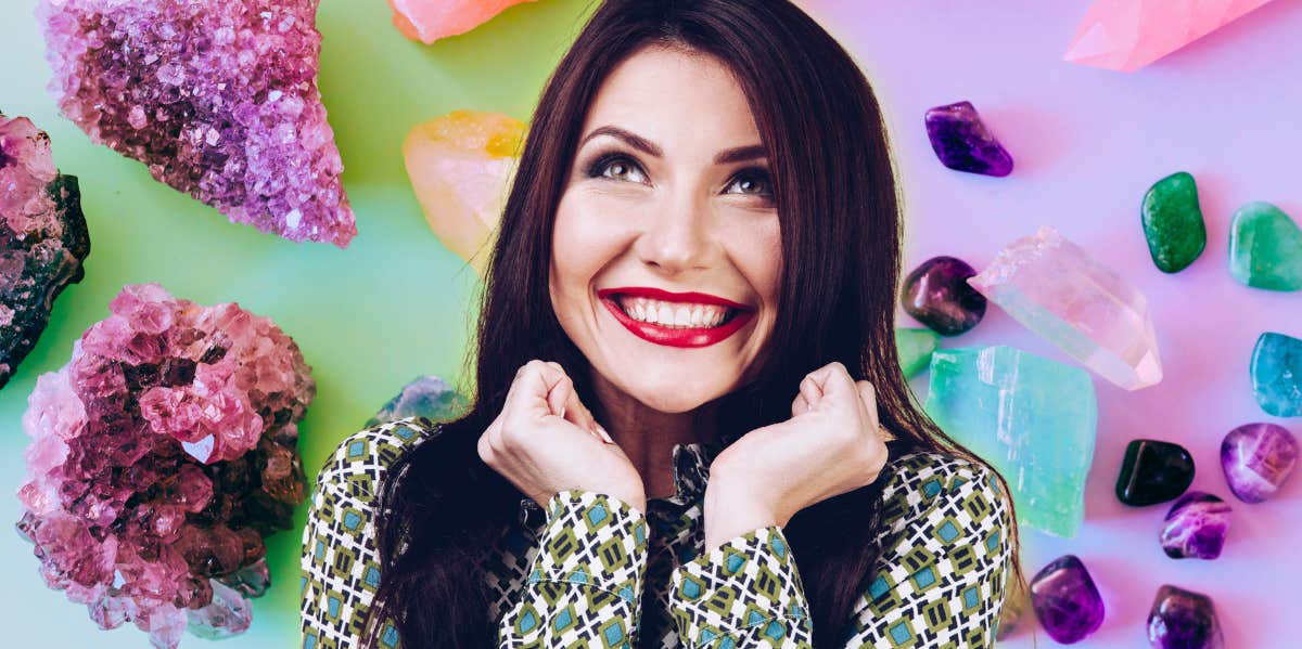 woman smiling with crystals around her