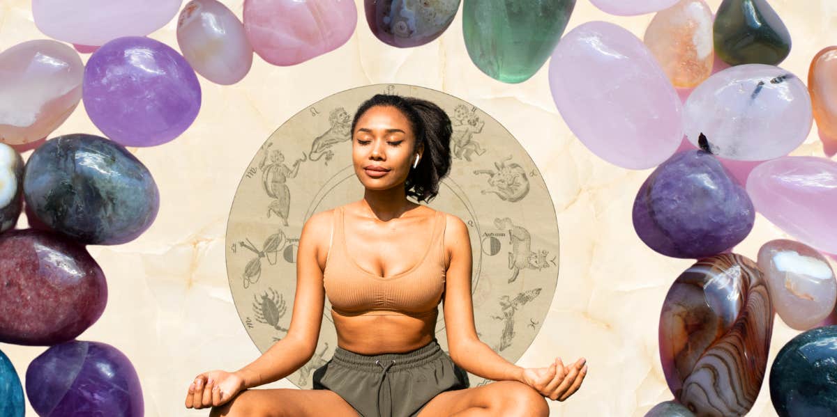 woman meditating surrounded by crystals