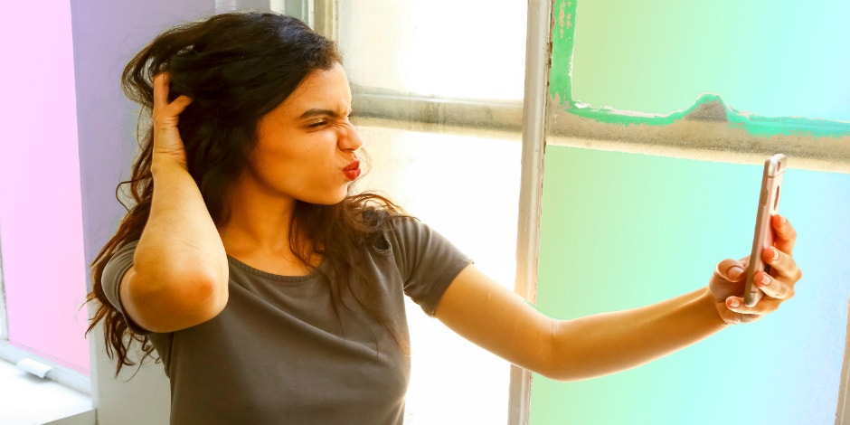 30 Best Cute Instagram Selfie Captions girl taking selfie for Instagram