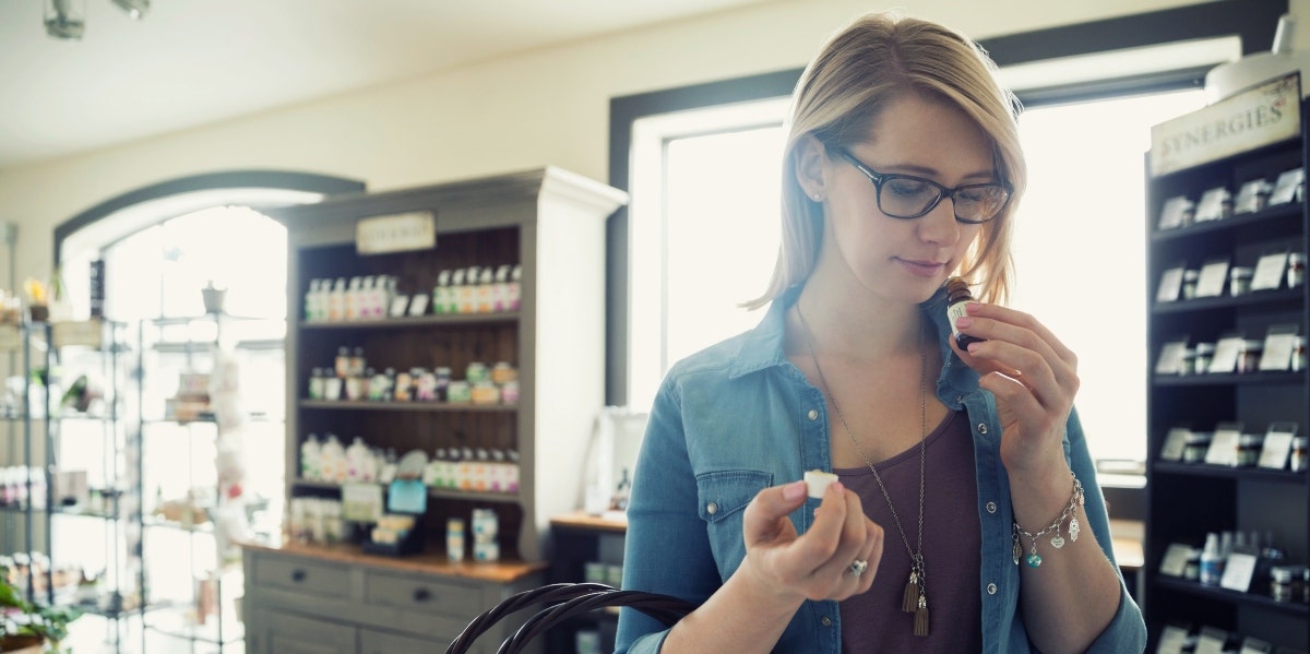 woman trying fall essential oils