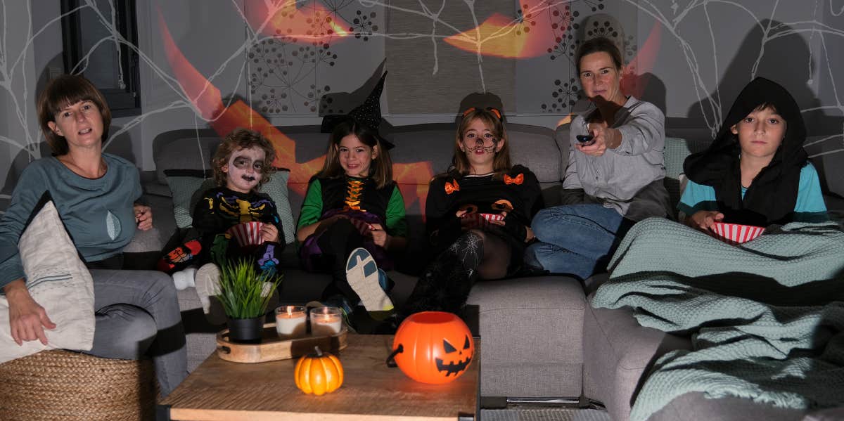 Family watching tv on Halloween