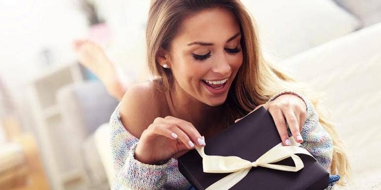 woman opening gift