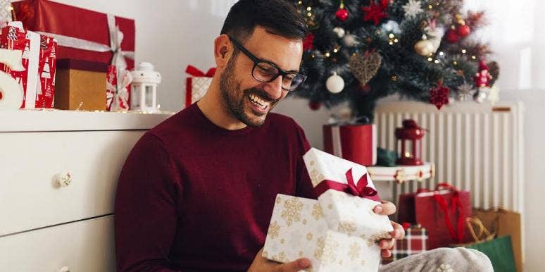 man opening presents