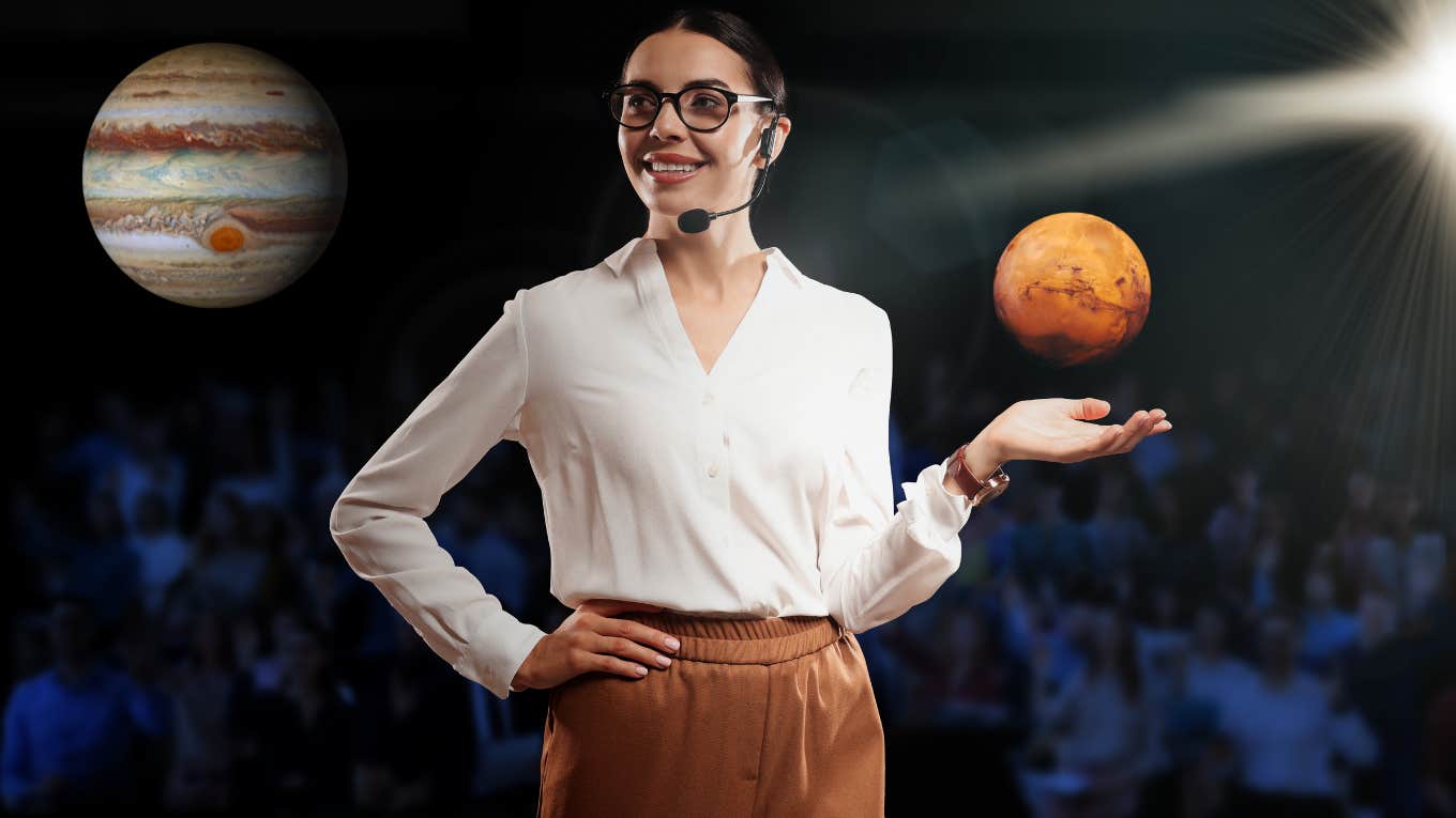 woman holding mars and looking at jupiter