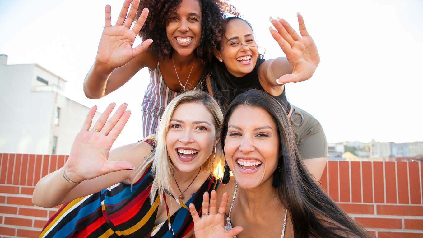 group of female friends smiling