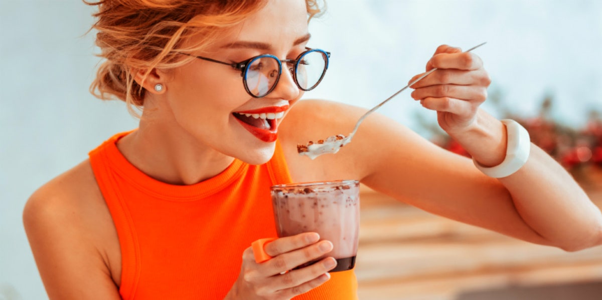 woman eating yogurt