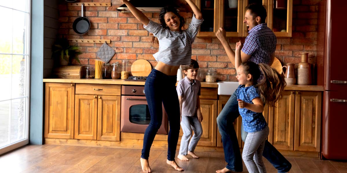 happy family dancing to the best songs for mothers day