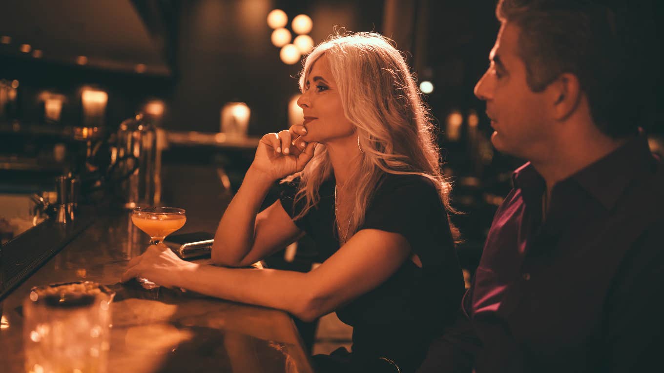 man and woman on date at bar