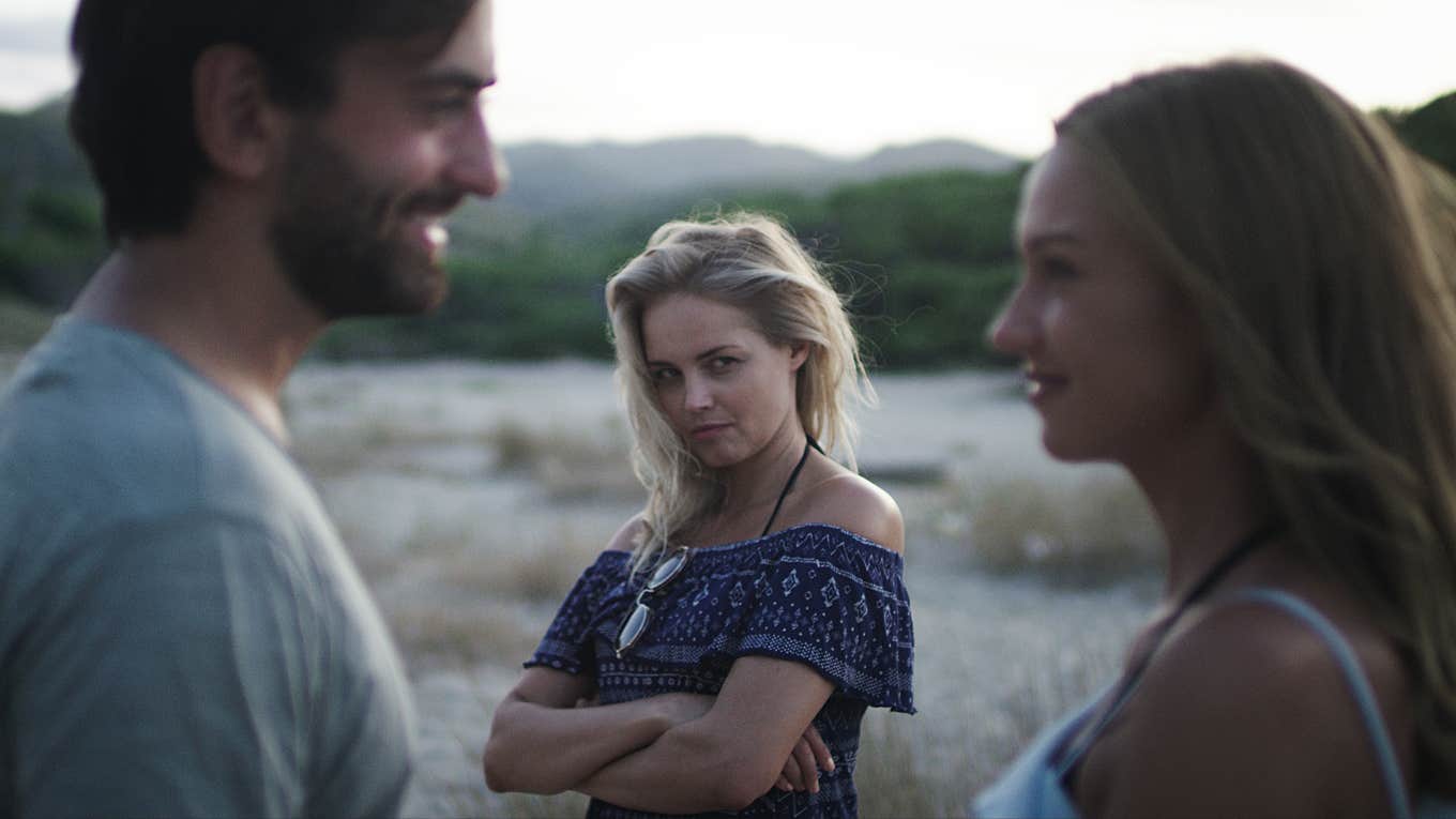 The Biggest Issue With Practicing Non-Monogamy Woman jealous of man talking to another woman