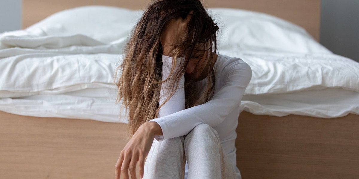 Divorce Regret: 5 Biggest Regrets Divorcees Have About Their Marriages Woman looking down with her head in her hand
