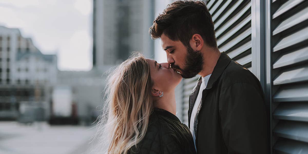 man and woman kissing