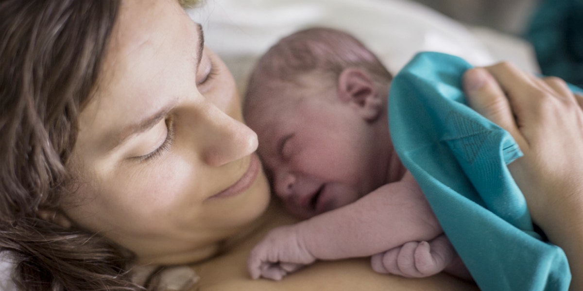 photo of mom ohlding a newborn baby