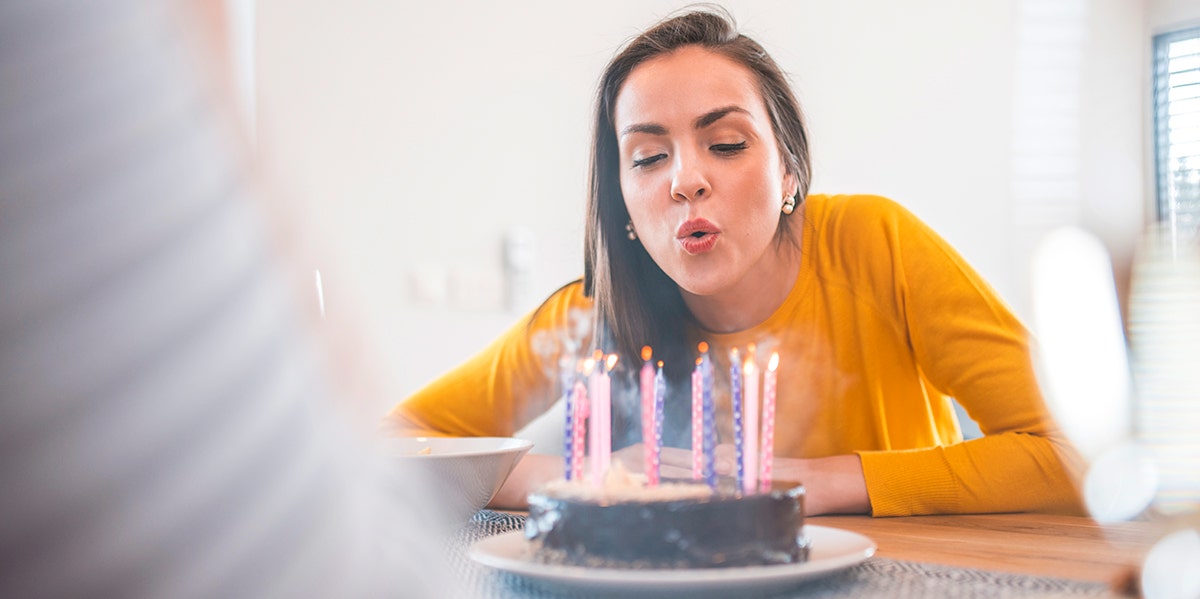 The Crazy Insights Your Birth Month Reveals About You And Your Life woman blowing out birthday candles