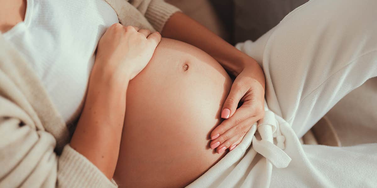 Getting Pregnant Spiraled Me Into An Eating Disorder woman's pregnant belly
