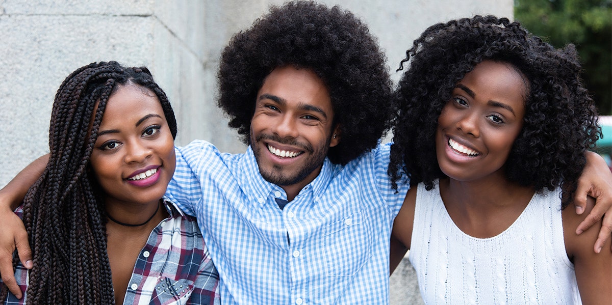 a group of black people smiling