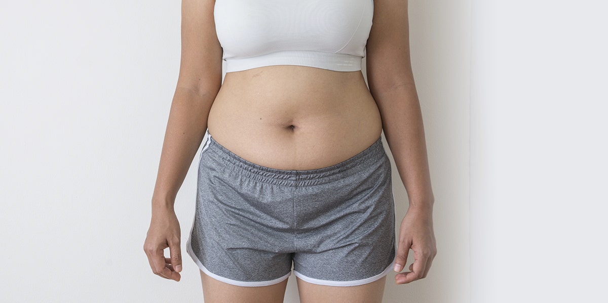 woman in crop top and shorts