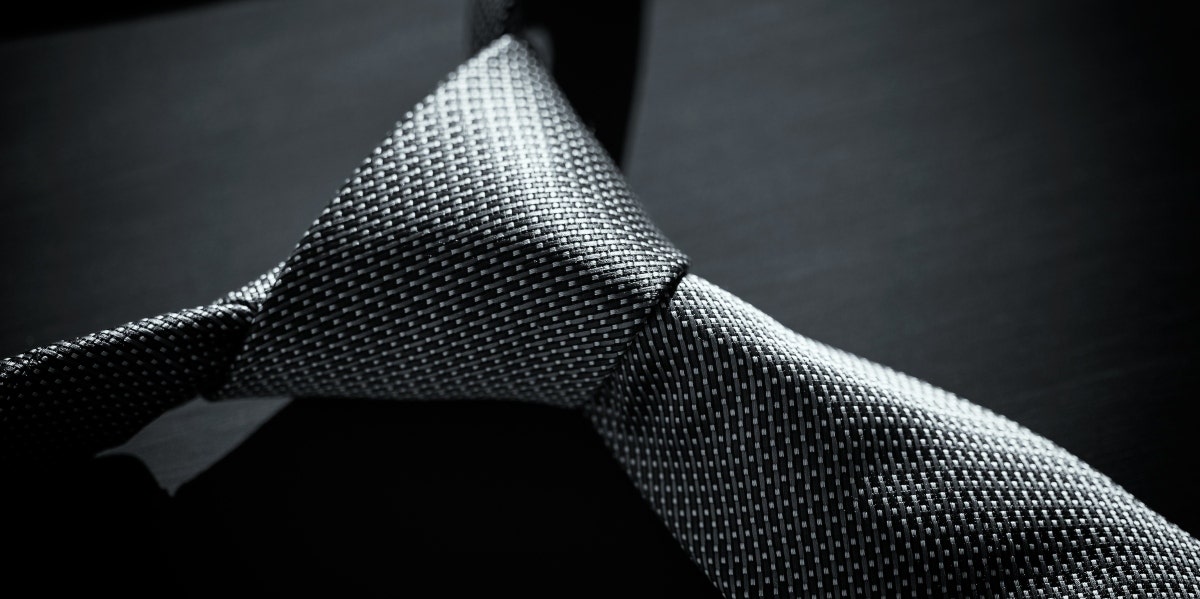 15 Steamy Books Like 50 Shades Of Grey greyscale image of a tie