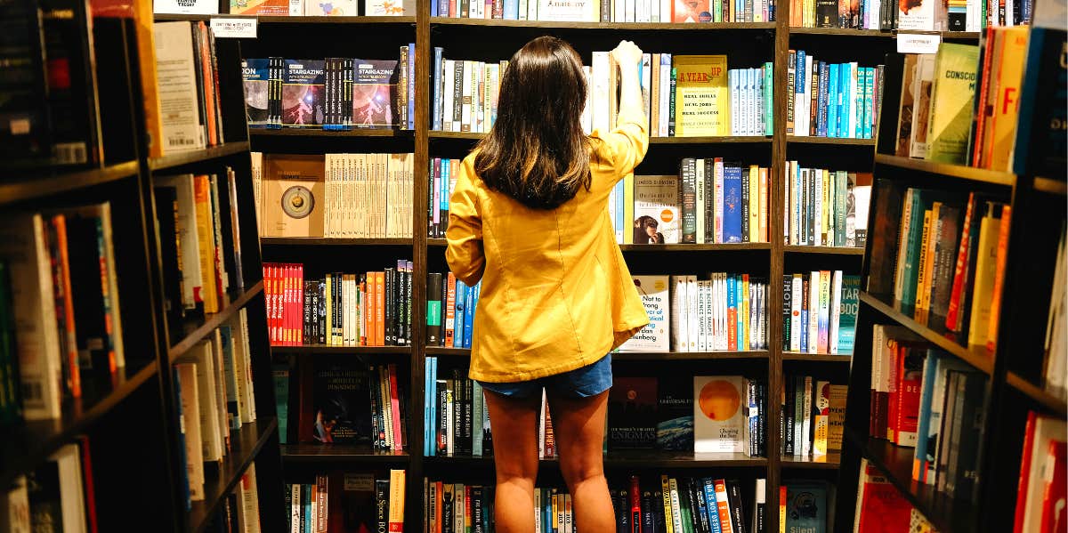 woman organizing books