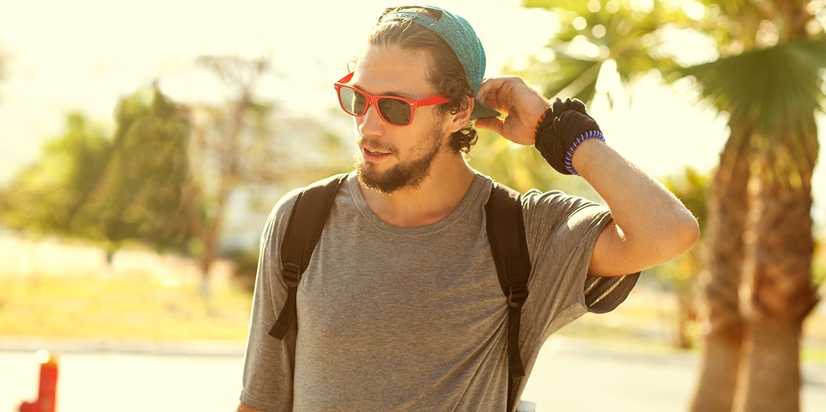 man in sunglasses with backpack on